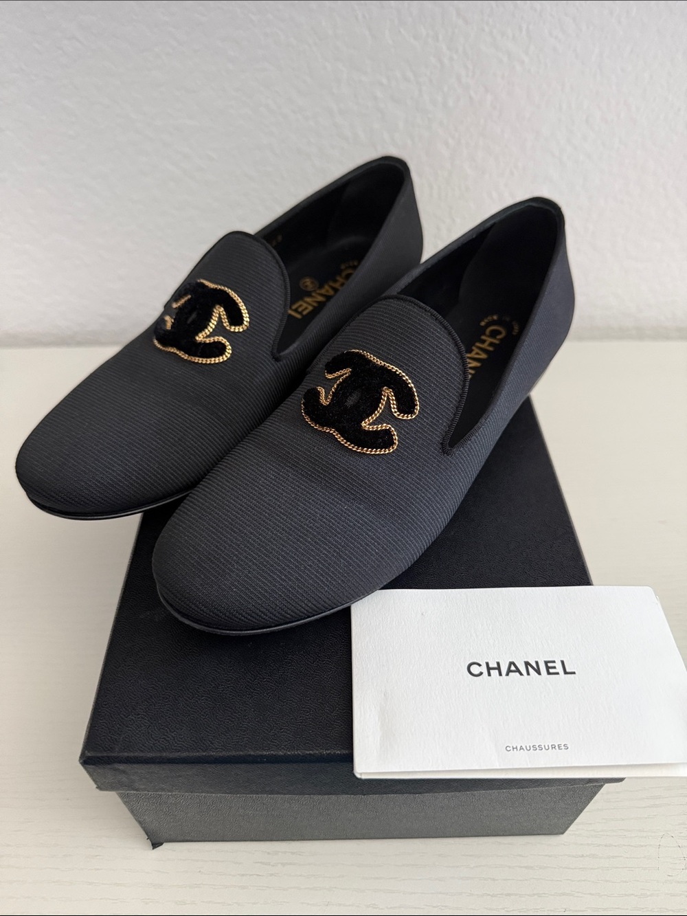 CHANEL Black Embroidered CC Logo Slip-On Flats with Gold Stitching
